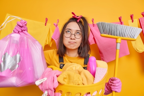 Tired,Displeased,Asian,Woman,Does,Housework,Holds,Big,Polythene,Rubbish